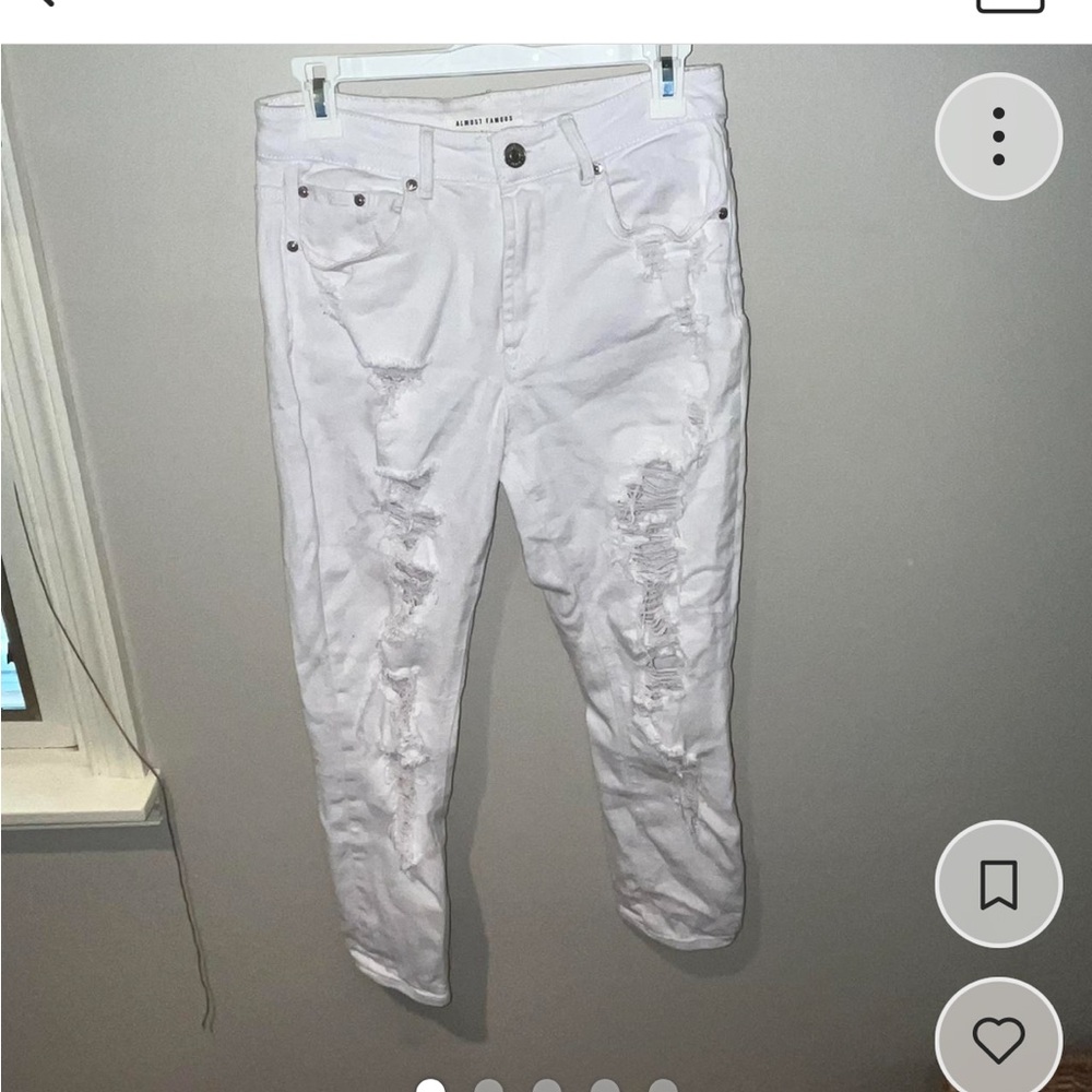 Distressed white jeans
